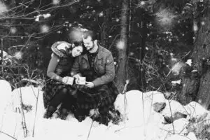 A couple poses for their winter engagement photos