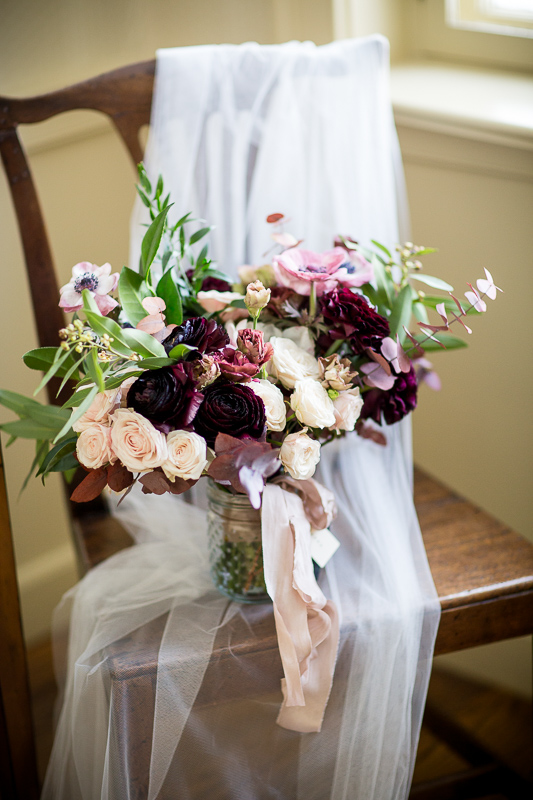 Fast Pony winter bridal bouquet with the bride's veil, in the bridal suite at the Grafton Inn, Grafton, Vermont