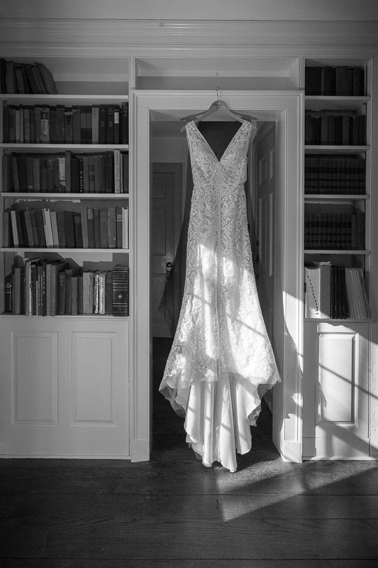 brides dress hanging in the library at the Grafton Inn