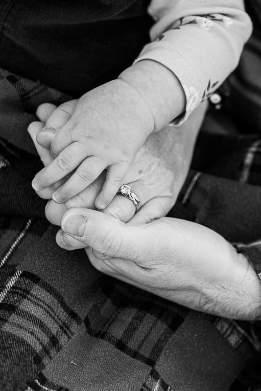 Mom and Dad hold babies hand