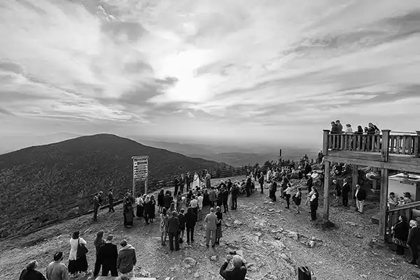 Panoramic view of Vermont fall foliage from Jay Peak Resort summit during outdoor wedding ceremony.