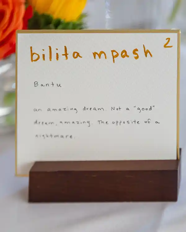 Wedding reception table name cards featuring unique and unusual words at Jay Peak Resort Vermont fall wedding reception.