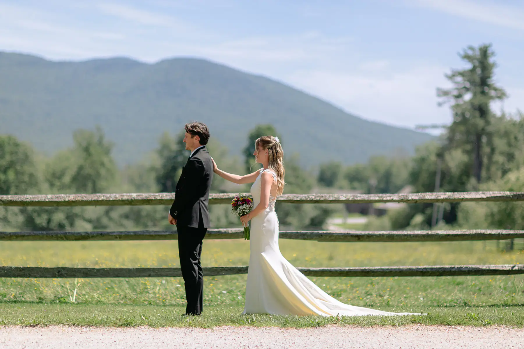The first Look before the wedding at the top of the horse pasture at Mountain Top Inn