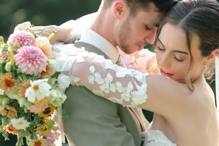 bride and groom snuggle in the vermont sun