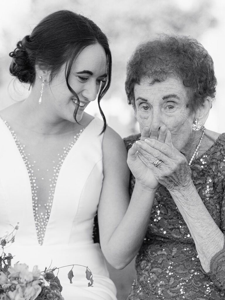 Grandmother kisses the brides hand