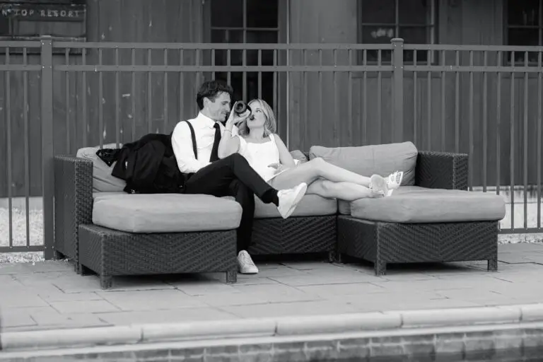 A bride and groom enjoy a quite moment by the pool at Mountain Top Resort