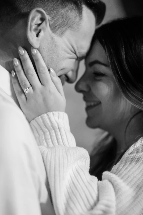 black and white detail portrait of bride to be and new engagement ring