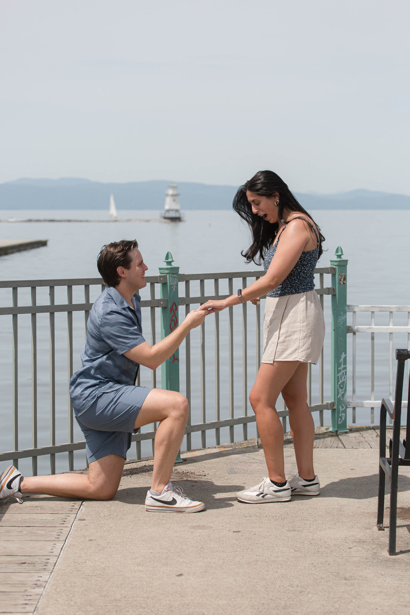 the moment of yes proposal in the fishing pier in burlington, vermont
