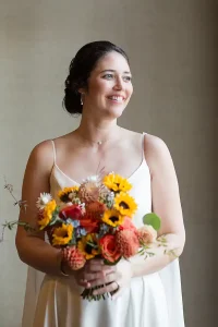 Bride in full wedding attire portrait at Jay Peak Resort during Vermont fall wedding.