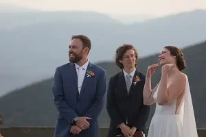 Friend reads original Dr. Seuss-inspired poem during wedding ceremony at Jay Peak Resort Vermont.