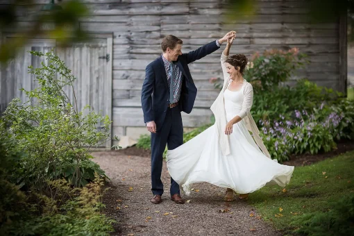 A groom twirling his bride