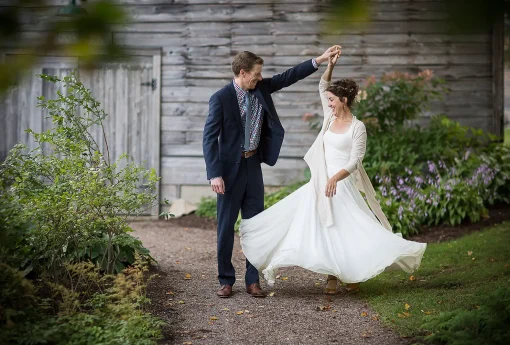A groom twirling his bride