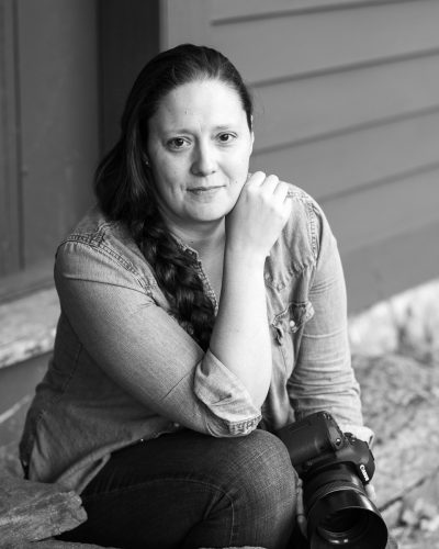 Portrait of Lindsay Raymondjack , vermont wedding photographer sitting on the steps of the Ethan Allen Homestead in Burlington, Vermont Photo by MoHo Photo