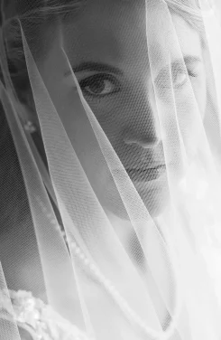 detail of a bring looking throught her veil