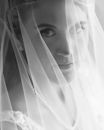 detail of a bring looking throught her veil